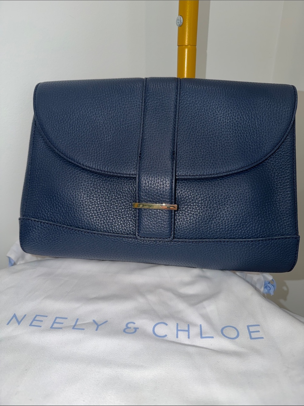 Neely & Chloe Navy Pebbled Leather Clutch with Strap Detail